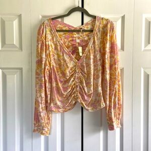 Free people top. Size large. Never been worn with tags!